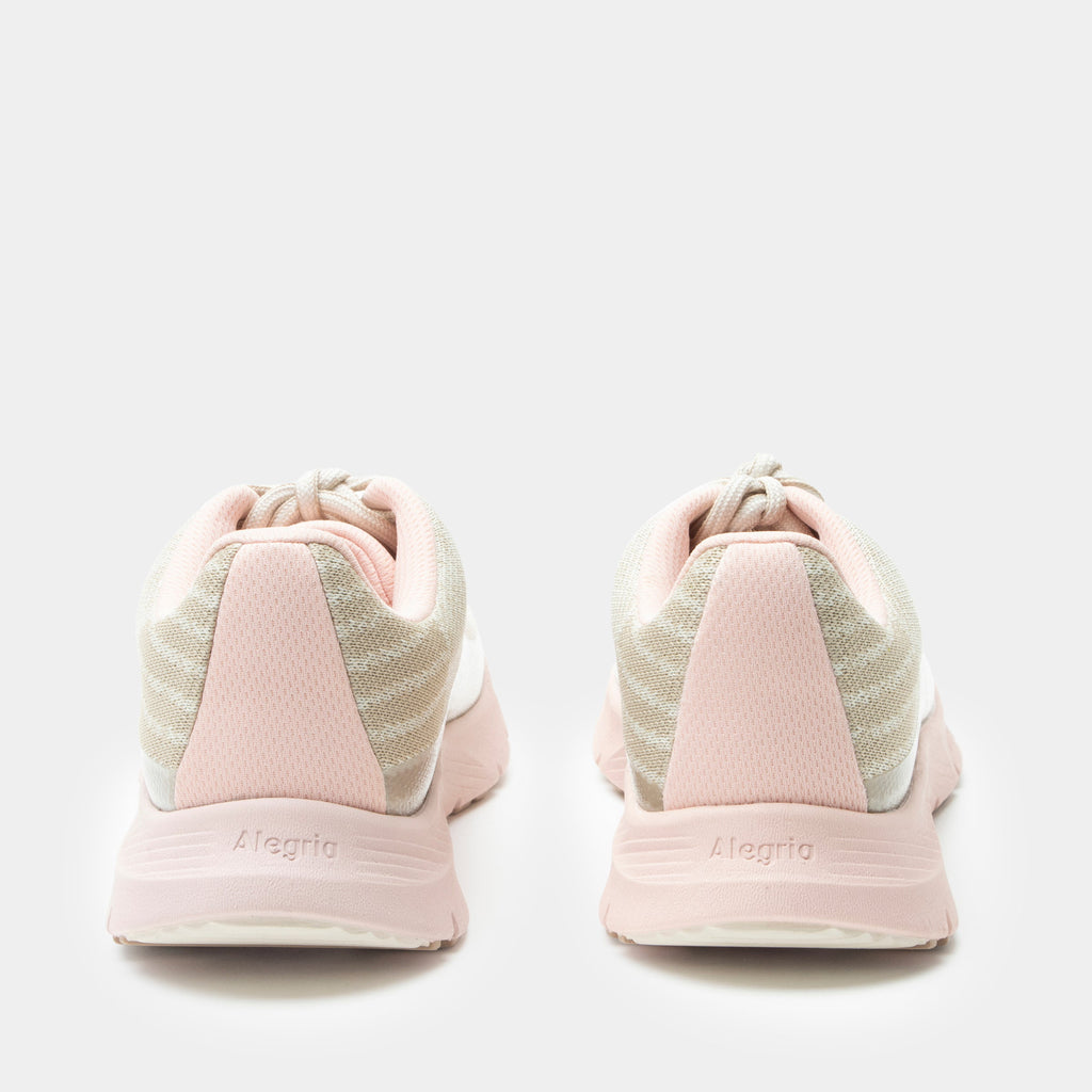 Revl Blush shoe on a lightweight EVA Rebounce outsole | Lace up shoe with a tan knit upper and pink outsole.