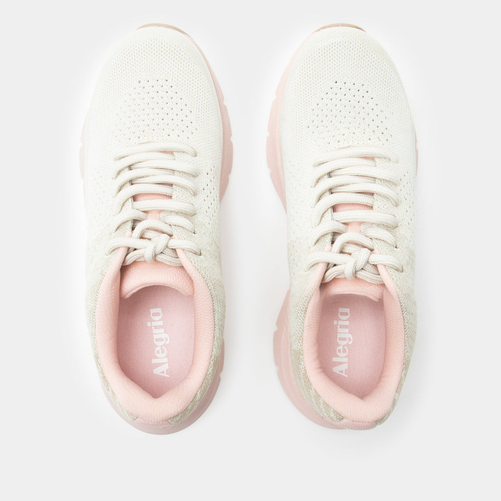 Revl Blush shoe on a lightweight EVA Rebounce outsole | Lace up shoe with a tan knit upper and pink outsole.