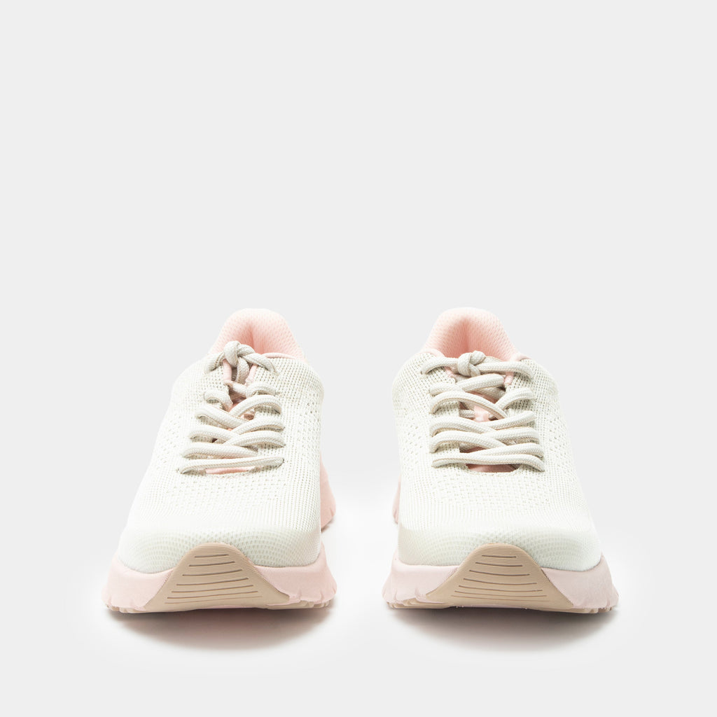 Revl Blush shoe on a lightweight EVA Rebounce outsole | Lace up shoe with a tan knit upper and pink outsole.