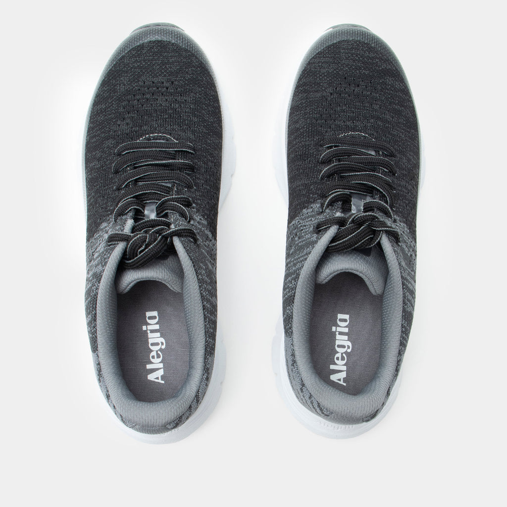 Revl Graphite shoe on a lightweight EVA Rebounce outsole | Lace up shoe with a black and grey knit upper and white outsole.