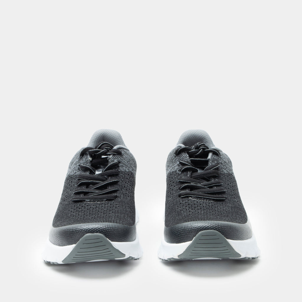 Revl Graphite shoe on a lightweight EVA Rebounce outsole | Lace up shoe with a black and grey knit upper and white outsole.