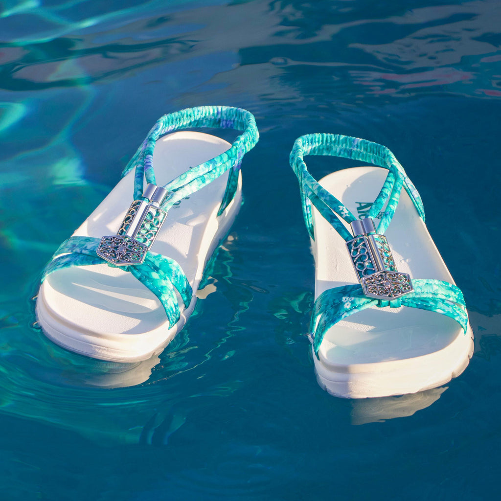 Roz Aqua Flora t-strap sandal | Blue braided vegan uppers and decorative sliver hardware.