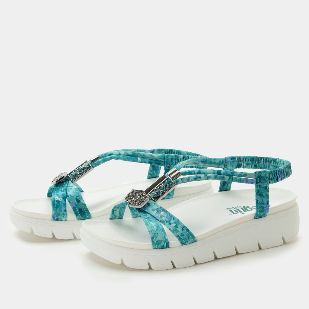 Roz Aqua Flora t-strap sandal | Blue braided vegan uppers and decorative sliver hardware.