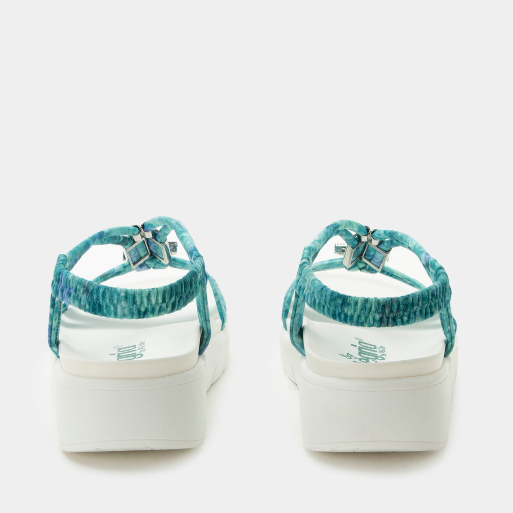 Roz Aqua Flora t-strap sandal | Blue braided vegan uppers and decorative sliver hardware.