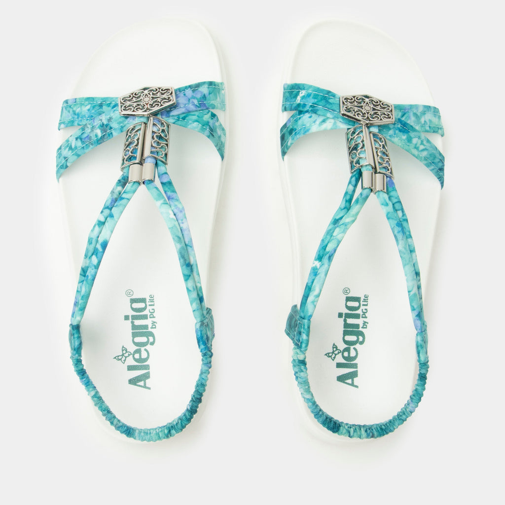 Roz Aqua Flora t-strap sandal | Blue braided vegan uppers and decorative sliver hardware.