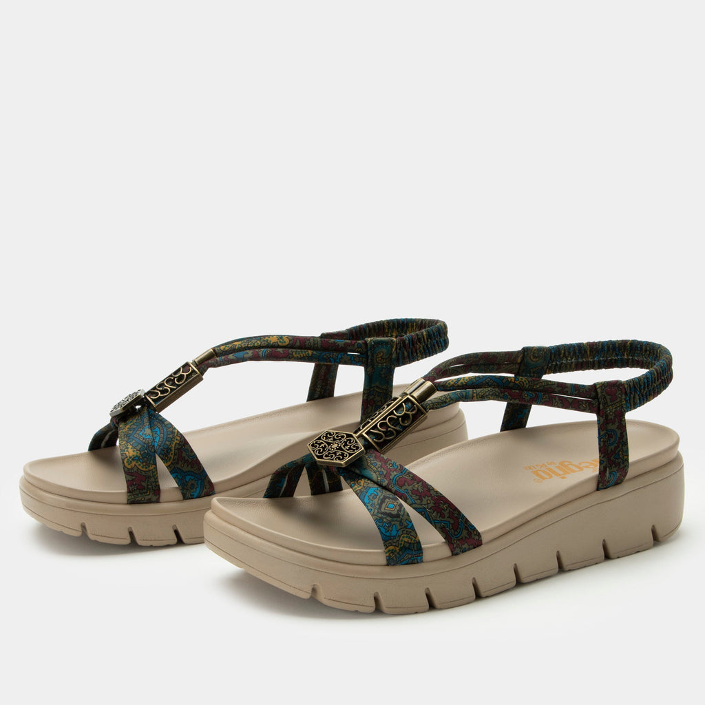 Roz Pretty Elite t-strap sandal | Multi colored floral braided vegan uppers and decorative bronze hardware.