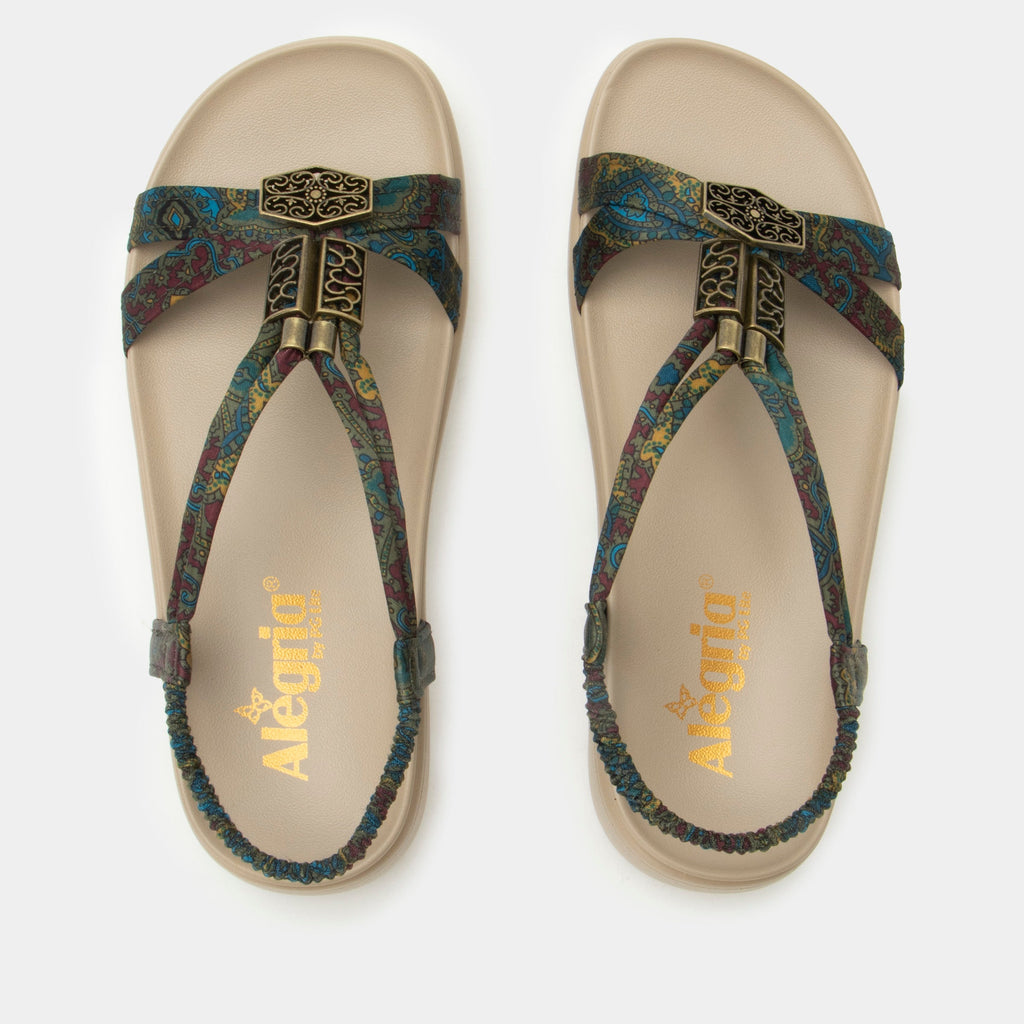 Roz Pretty Elite t-strap sandal | Multi colored floral braided vegan uppers and decorative bronze hardware.