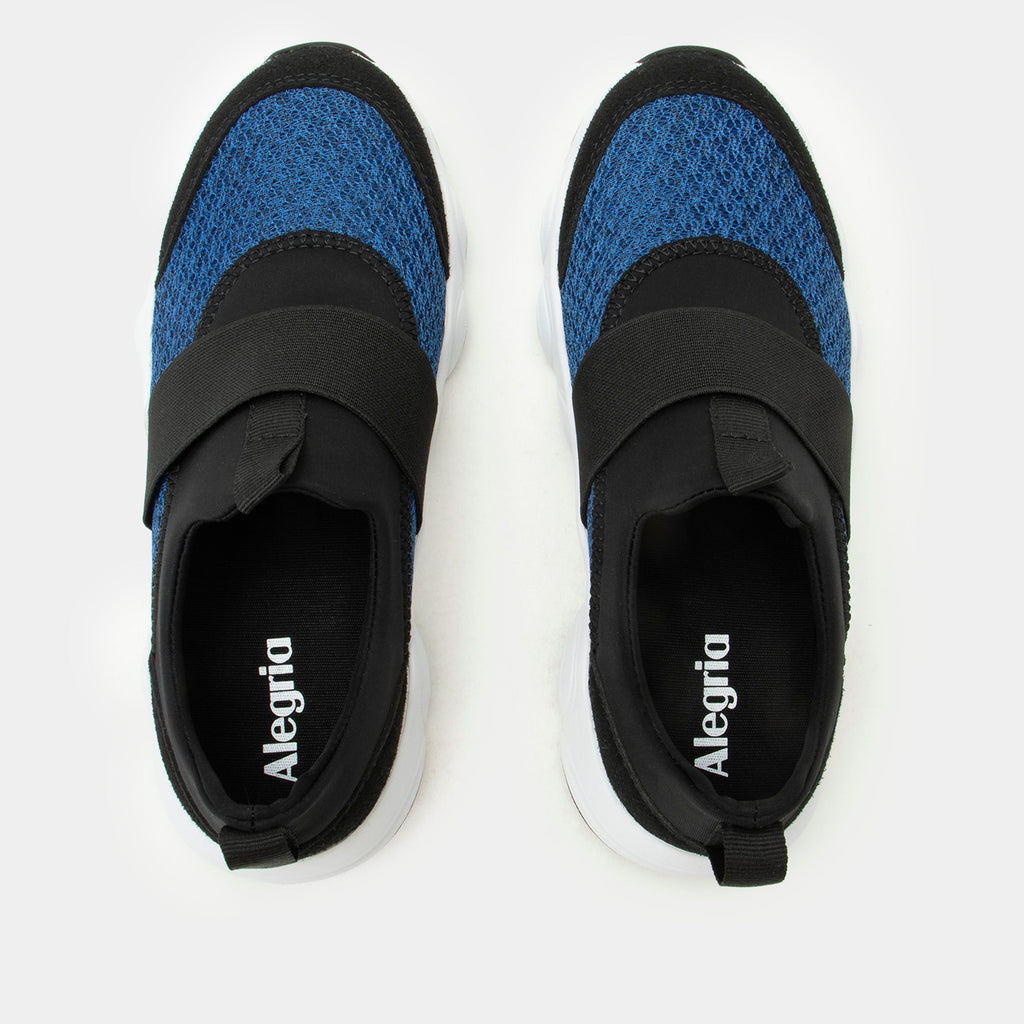 Sleek Joy Royal Blue shoe on a lightweight EVA Boom Joy outsole. | Blue slip-on shoe with black details and an elastic vamp strap.