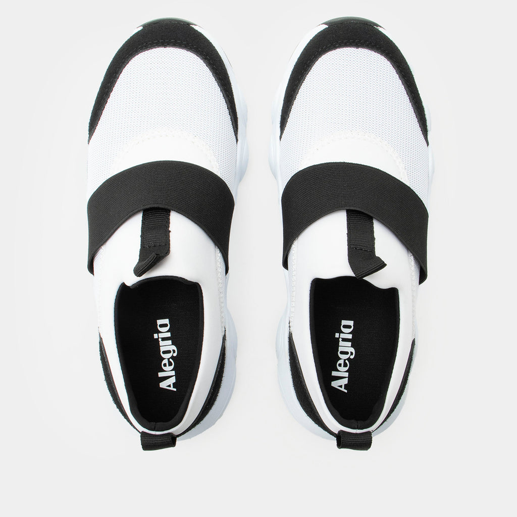 Sleek Joy Panda shoe on a lightweight EVA Boom Joy outsole | White slip-on shoe with black details and an elastic vamp strap.