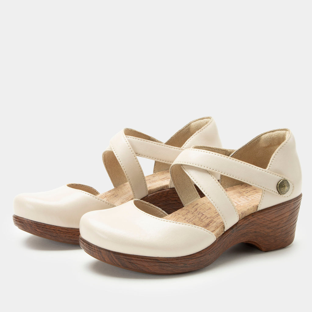 Savina Oat shoe with an adjustable strap on a wood look wedge outsole | Cream colored mary jane style shoe on a wedge.