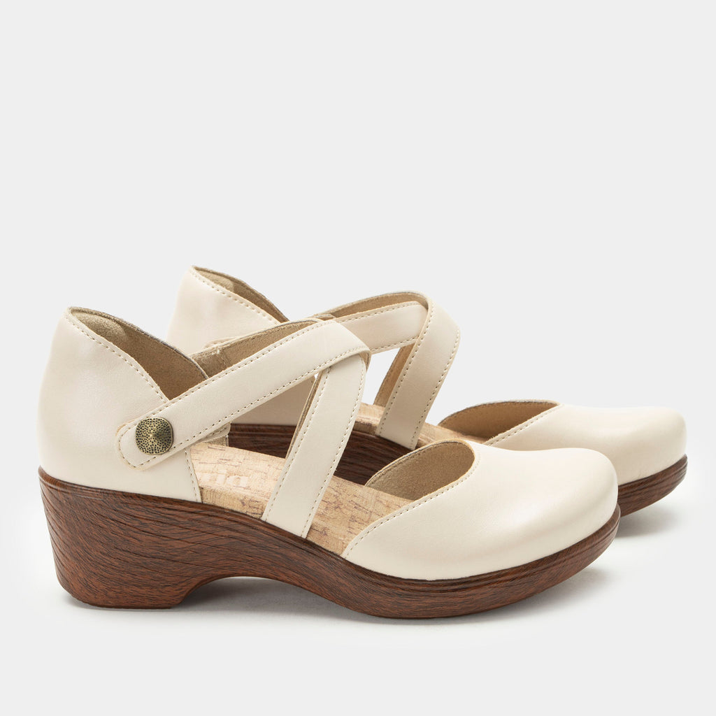 Savina Oat shoe with an adjustable strap on a wood look wedge outsole | Cream colored mary jane style shoe on a wedge.