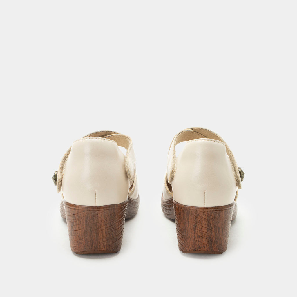 Savina Oat shoe with an adjustable strap on a wood look wedge outsole | Cream colored mary jane style shoe on a wedge.