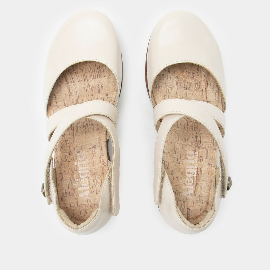 Savina Oat shoe with an adjustable strap on a wood look wedge outsole | Cream colored mary jane style shoe on a wedge.