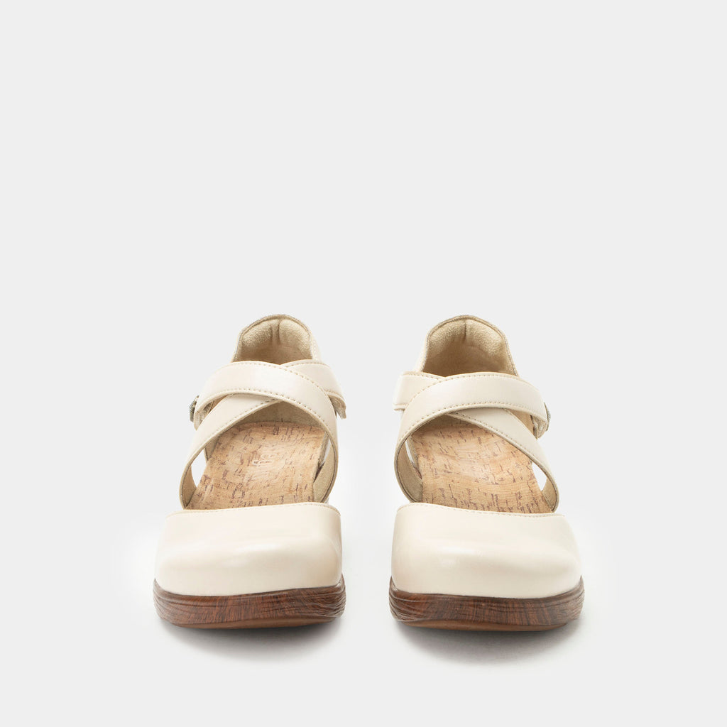 Savina Oat shoe with an adjustable strap on a wood look wedge outsole | Cream colored mary jane style shoe on a wedge.