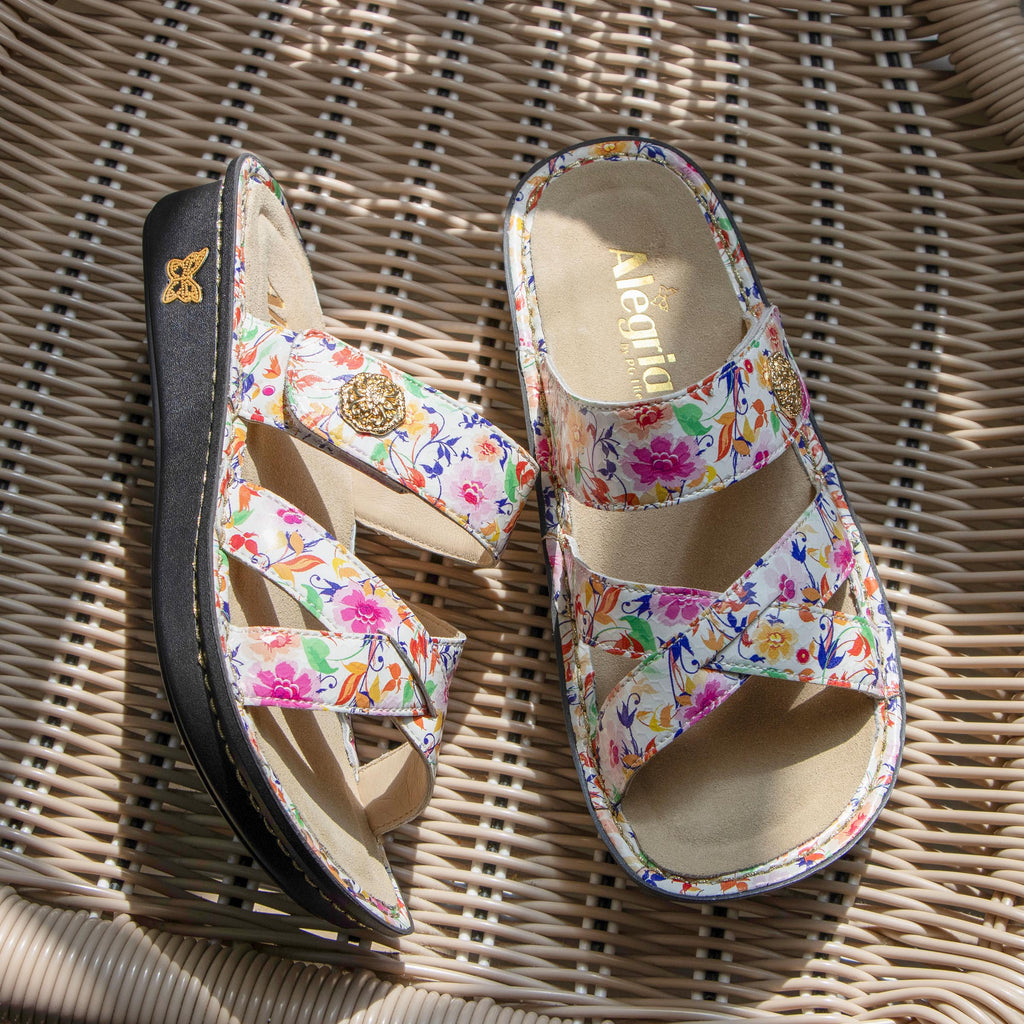 Victoriah Marvel sandal with crisscross detail and adjustable strap| Floral printed slip on sandal on a mini outsole.