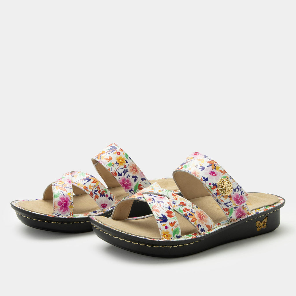 Victoriah Marvel sandal with crisscross detail and adjustable strap| Floral printed slip on sandal on a mini outsole.