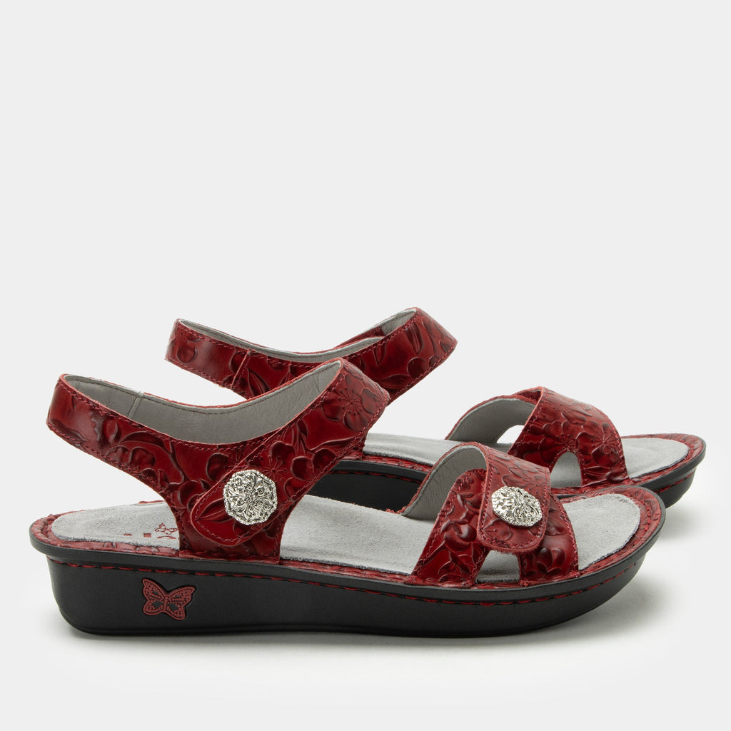 Vienna Loretta Roja Sandal with two adjustable hook and loop closures | Red floral embossed sandal on leather upper.